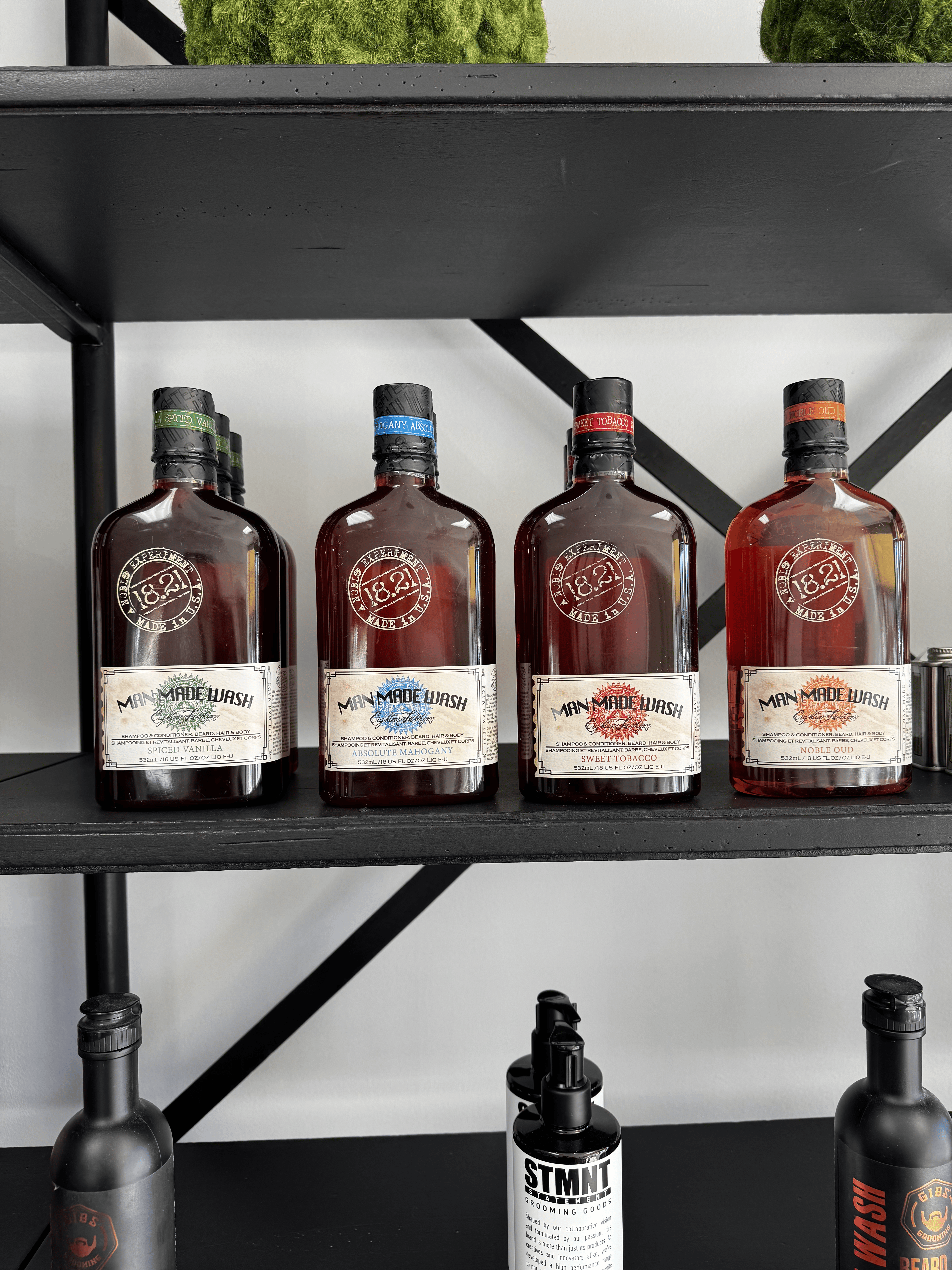 Man Made Wash grooming bottles displayed on salon shelf