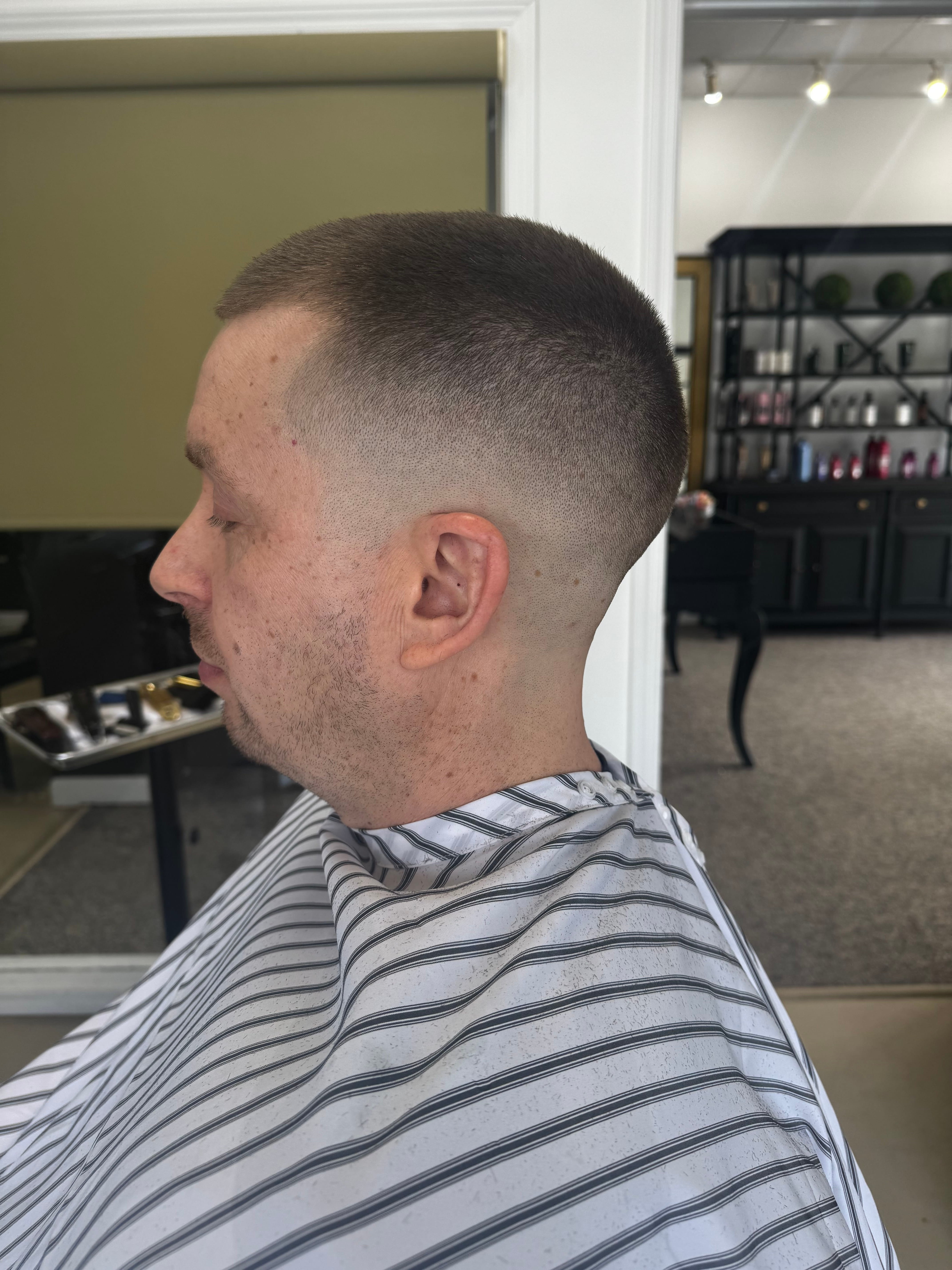 Textured haircut side profile inside the salon